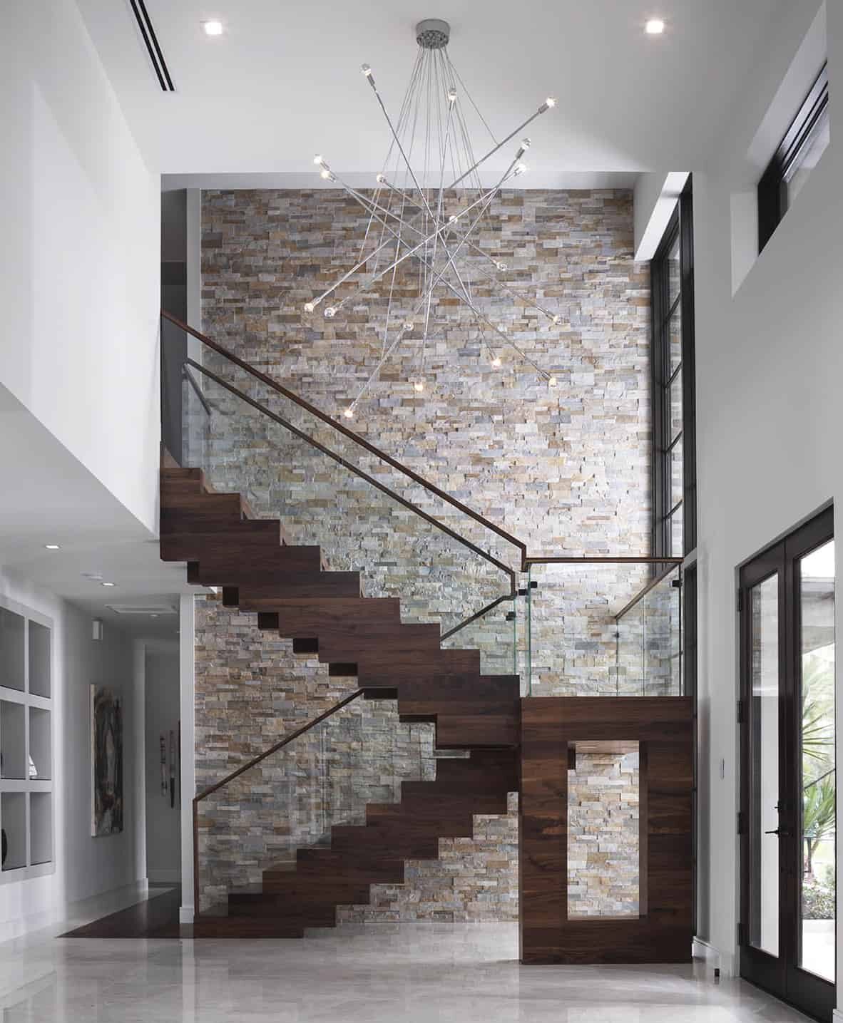 Modern stairway with Stone-Veneer-wall in a Home-Interior with wood stairwell details