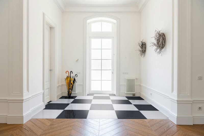 Black and White checkerboard floor in home entry way