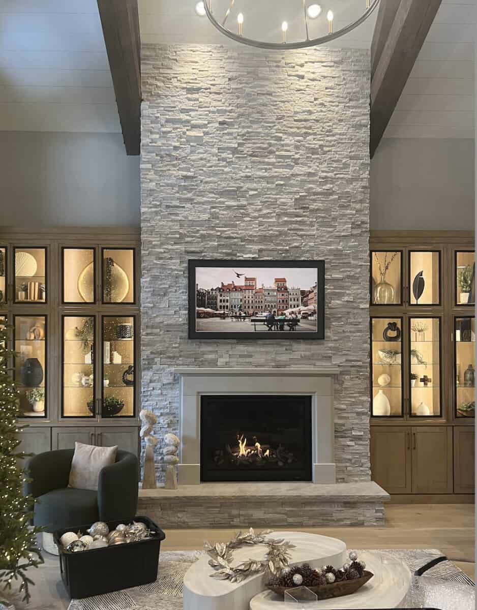 Tall light stone fireplace